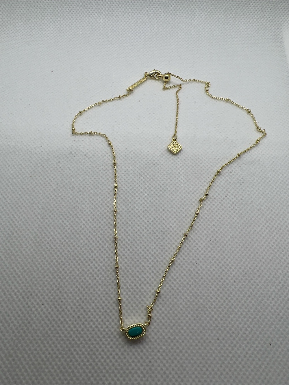 Kendra Scott Gold Necklace with Turquoise Oval Stone